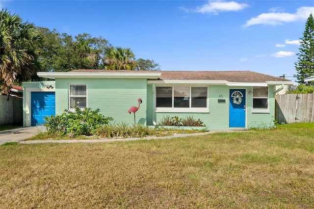 single story home with a garage and a front yard