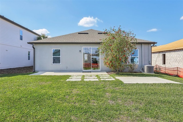 back of house with a patio, a lawn, and central air condition unit