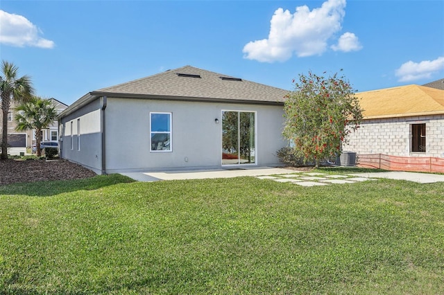 back of house with a yard, a patio, and central air condition unit