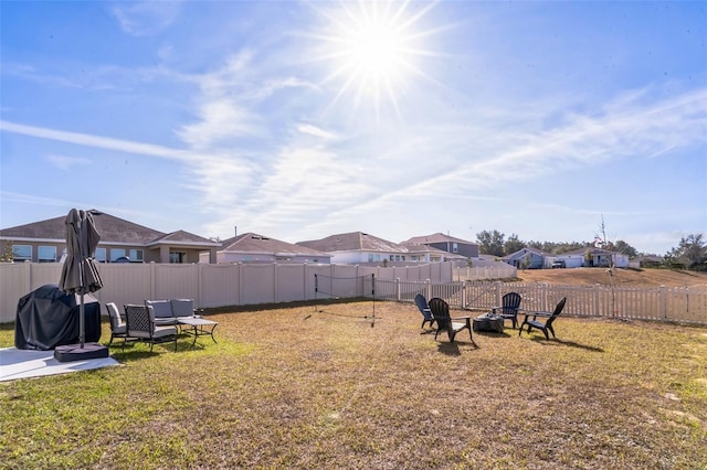 view of yard with an outdoor fire pit