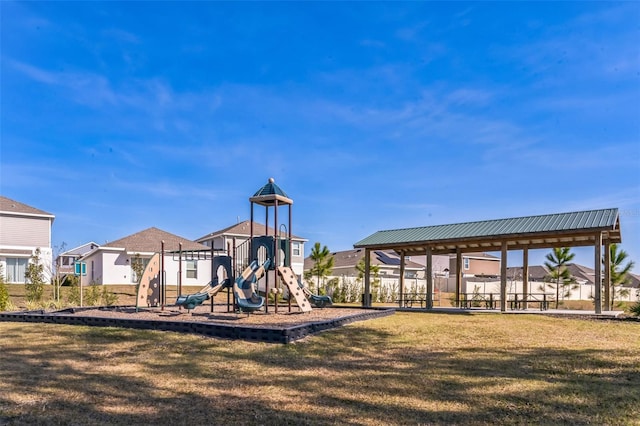 view of playground with a lawn