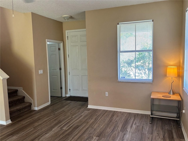 525 Aster Dr, Davenport, FL 33897 - interior space featuring dark wood-type flooring, baseboards, and stairs