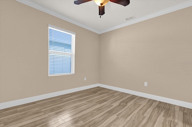 empty room with ornamental molding, ceiling fan, and light wood-type flooring