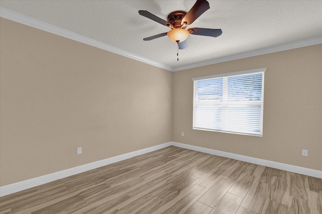 spare room with ornamental molding, a textured ceiling, ceiling fan, and light hardwood / wood-style flooring