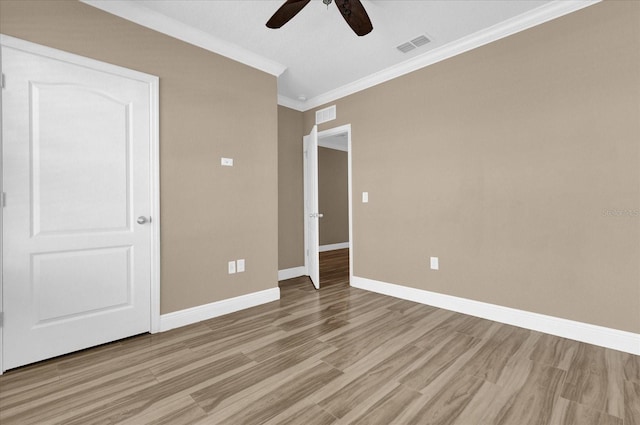 unfurnished bedroom featuring ornamental molding, light hardwood / wood-style floors, and ceiling fan