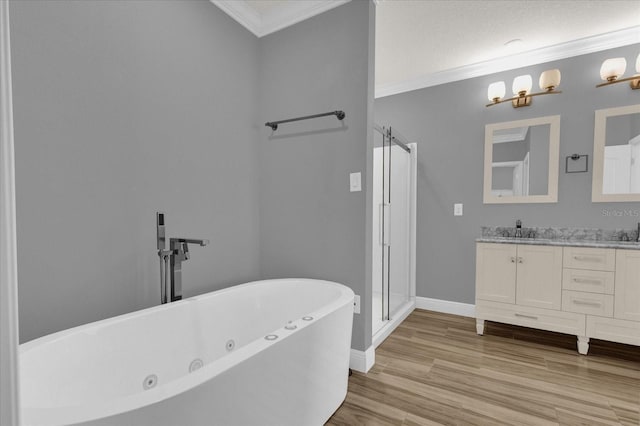 bathroom with ornamental molding, plus walk in shower, hardwood / wood-style floors, and vanity