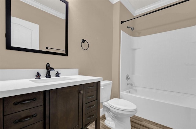 full bathroom featuring crown molding, hardwood / wood-style floors, vanity, bathtub / shower combination, and toilet