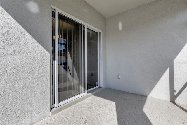 doorway to property with a balcony