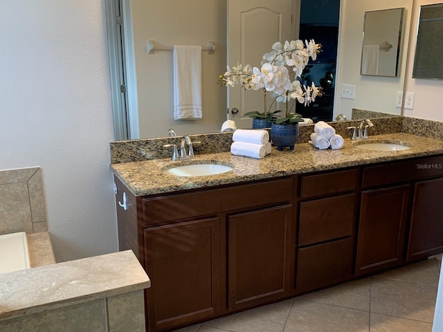 bathroom with tile patterned floors and vanity