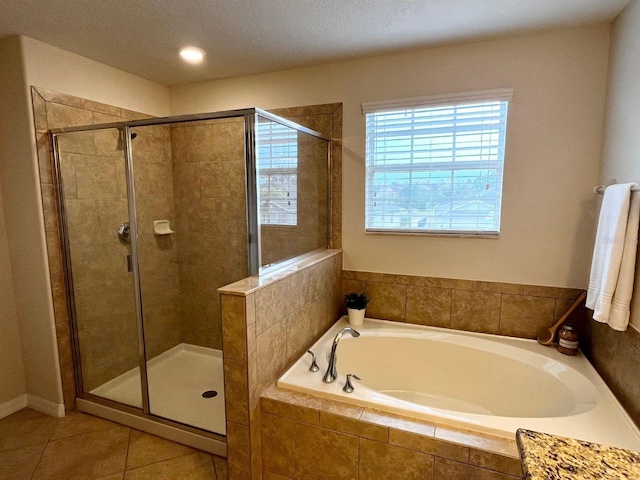 bathroom with plus walk in shower and tile patterned floors