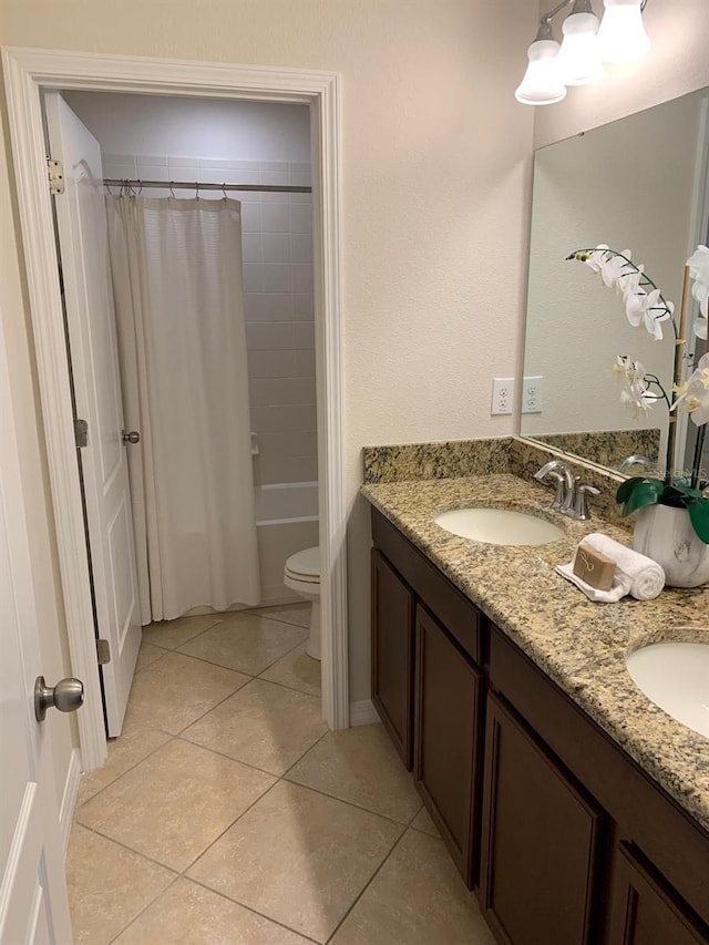 full bathroom featuring shower / tub combo, vanity, toilet, and tile patterned flooring