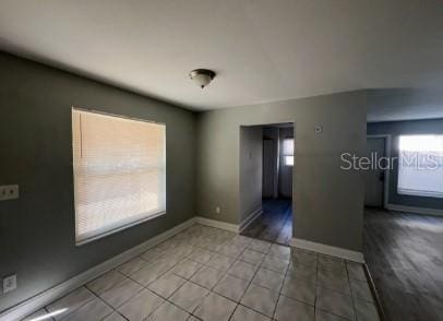 spare room featuring light tile patterned floors