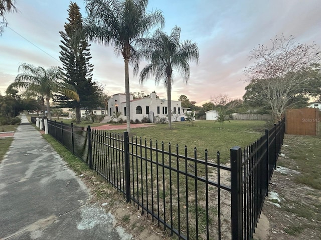 view of home's community featuring a lawn