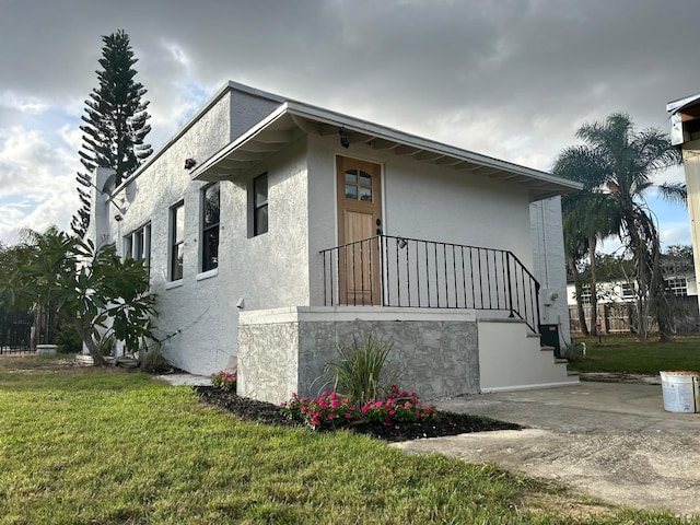 view of home's exterior featuring a lawn