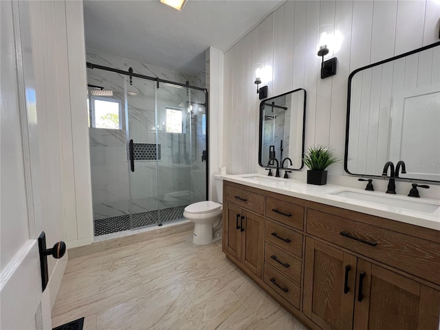 bathroom featuring vanity, toilet, and walk in shower