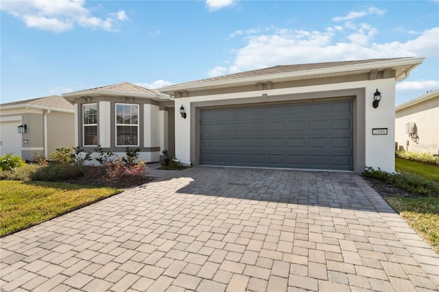 ranch-style house featuring a garage