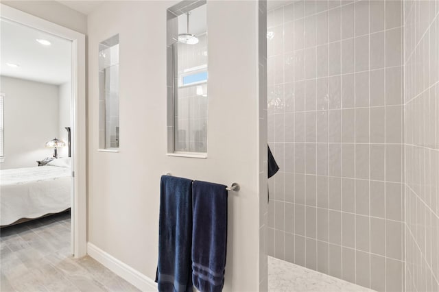 bathroom with a tile shower