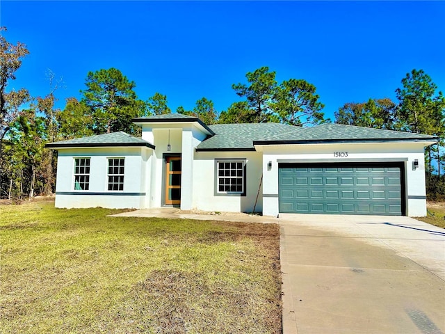 view of front of house featuring roof with shingles, stucco siding, a garage, driveway, and a front lawn