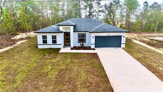 view of front facade with a garage, stucco siding, concrete driveway, and a front yard