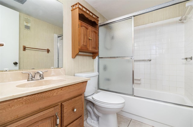 full bathroom with toilet, vanity, shower / bath combination with glass door, and tile patterned flooring