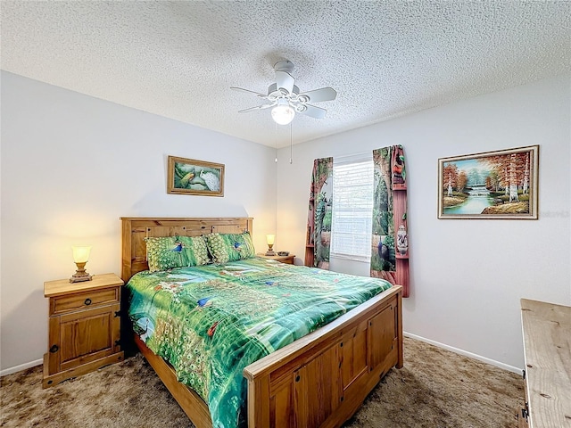 carpeted bedroom with ceiling fan and a textured ceiling