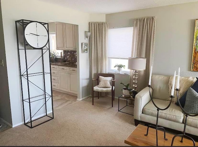 500 The Esplanade N Unit 405, Venice, FL 34285 - sitting room with baseboards and light colored carpet