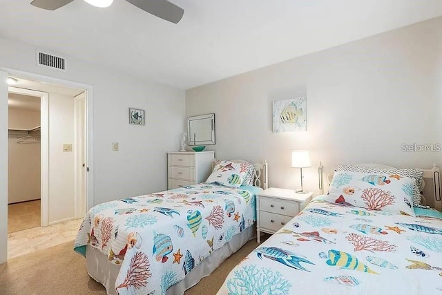 500 The Esplanade N Unit 405, Venice, FL 34285 - bedroom featuring light carpet, visible vents, and ceiling fan