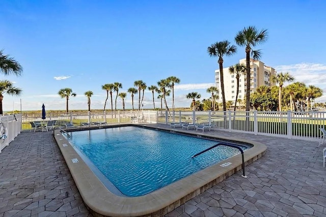 500 The Esplanade N Unit 405, Venice, FL 34285 - pool featuring fence and a patio