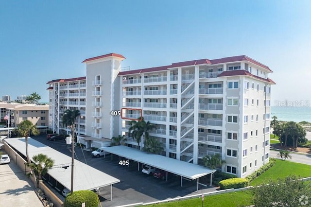 500 The Esplanade N Unit 405, Venice, FL 34285 - view of building exterior featuring covered parking
