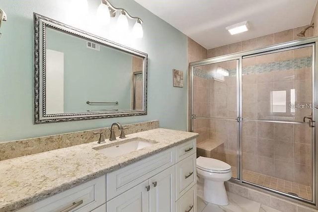 500 The Esplanade N Unit 405, Venice, FL 34285 - full bath featuring visible vents, toilet, a stall shower, and vanity