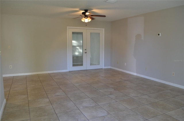 spare room with french doors and ceiling fan