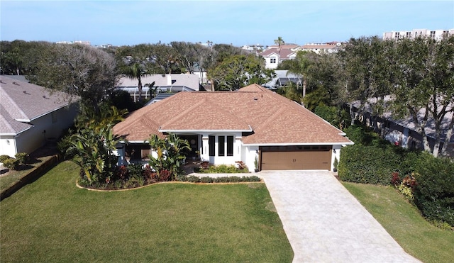 view of front facade with a garage and a front lawn