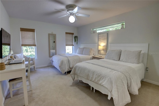 bedroom featuring ceiling fan, baseboards, and light carpet