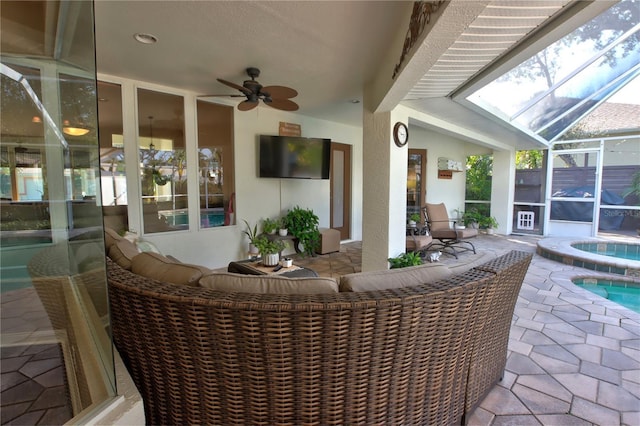 view of patio / terrace featuring glass enclosure, an in ground hot tub, an outdoor pool, and ceiling fan