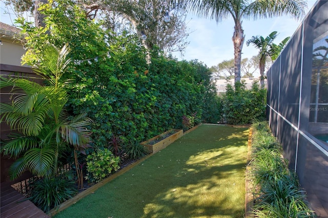 view of yard with a lanai