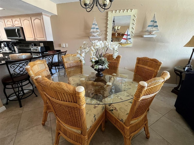 dining space featuring a notable chandelier and light tile patterned flooring