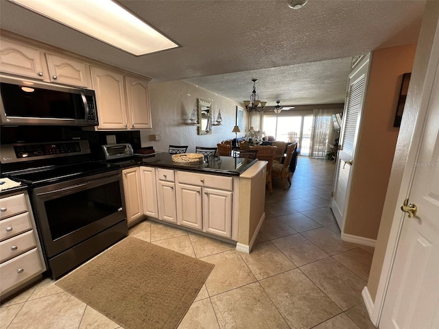 kitchen featuring stainless steel electric range oven, kitchen peninsula, a textured ceiling, and light tile patterned floors