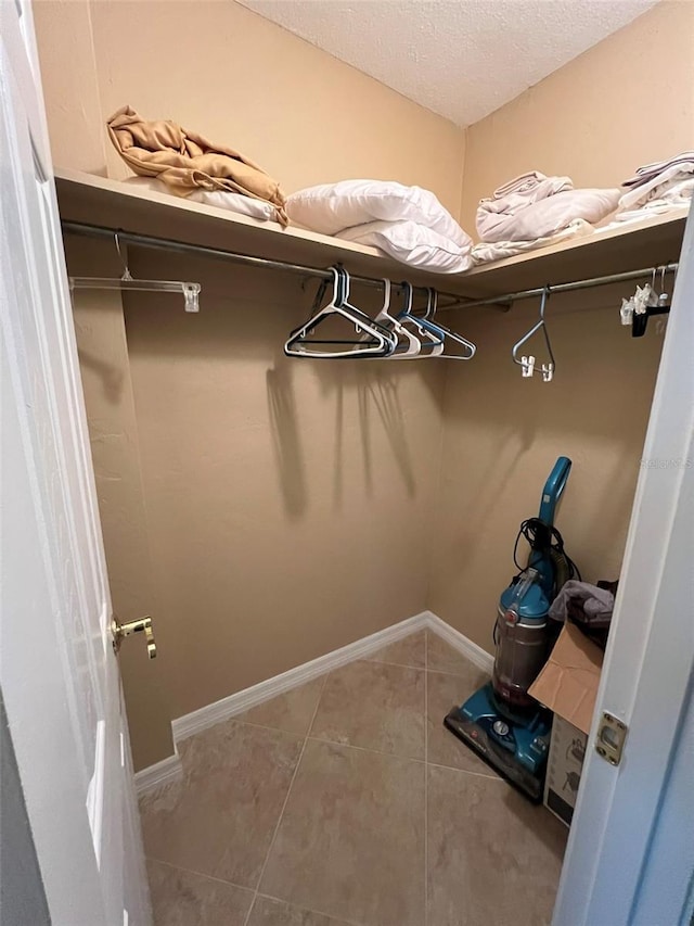 spacious closet featuring tile patterned floors