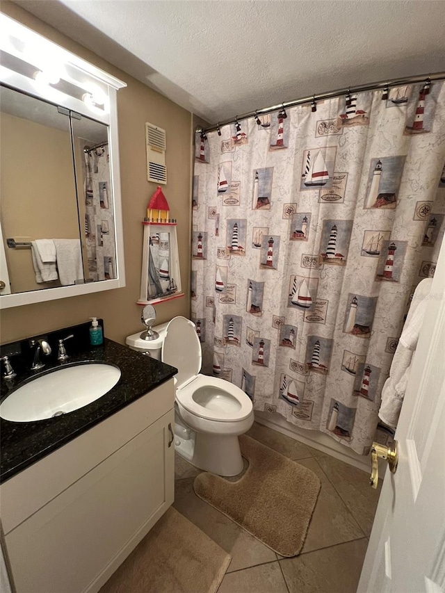 full bathroom with shower / tub combo with curtain, vanity, a textured ceiling, tile patterned floors, and toilet