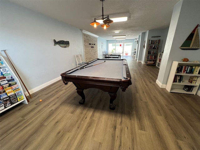 game room with hardwood / wood-style flooring, pool table, and a textured ceiling