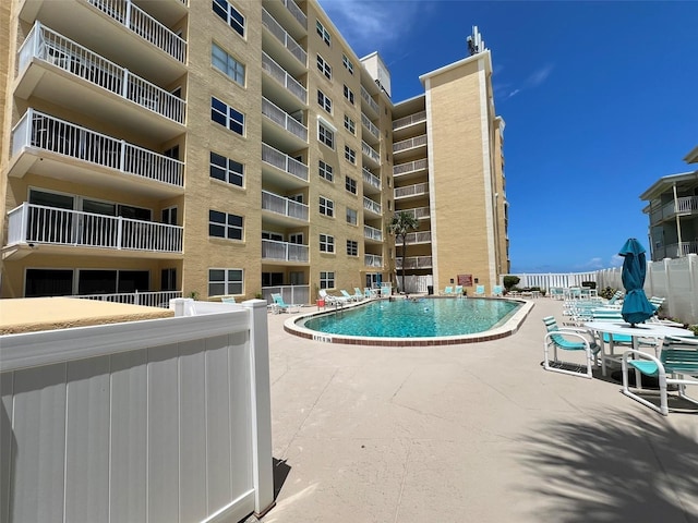 view of swimming pool with a patio area