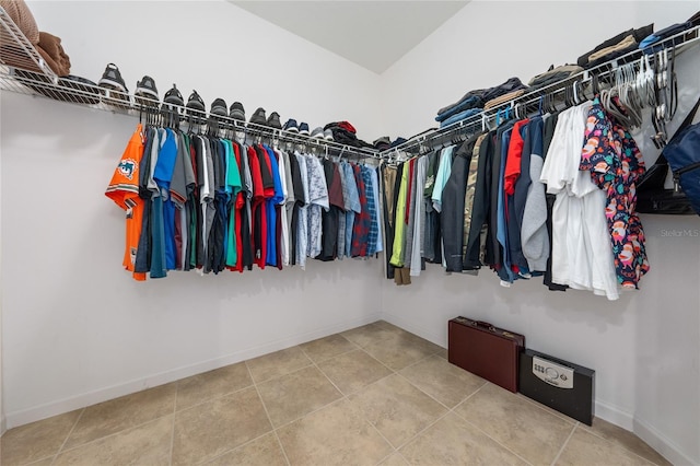 spacious closet featuring tile patterned floors