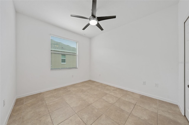 tiled empty room with ceiling fan