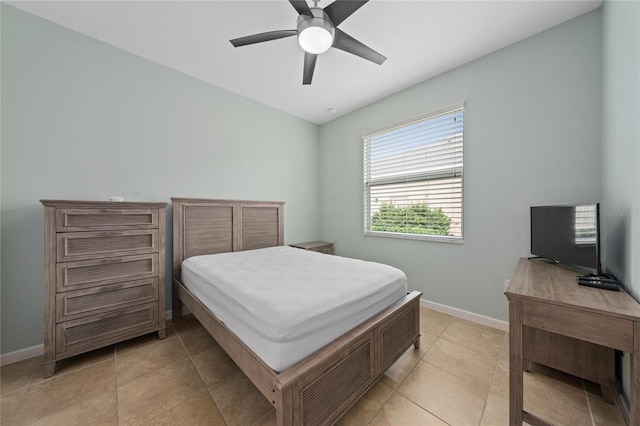 tiled bedroom with ceiling fan