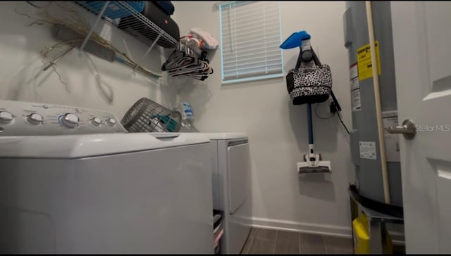 laundry room with independent washer and dryer