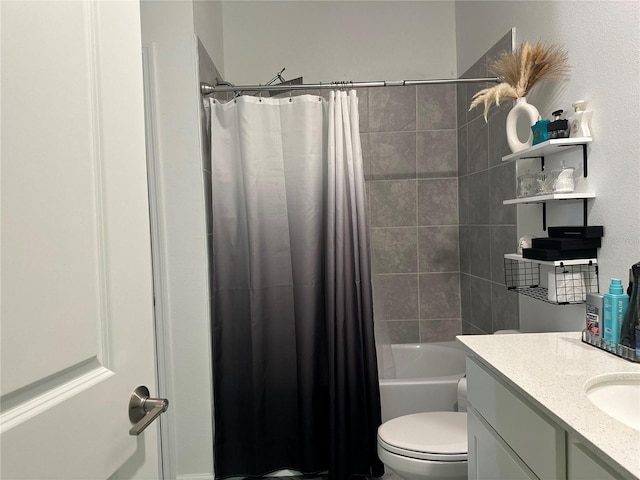 full bathroom with vanity, shower / tub combo, and toilet