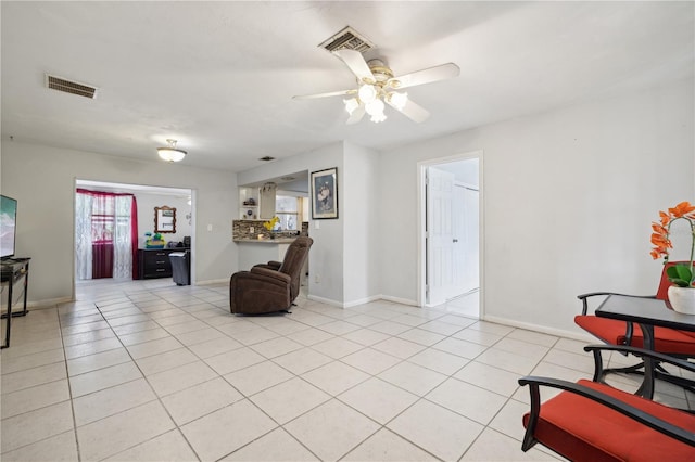 living room with light tile patterned floors and ceiling fan