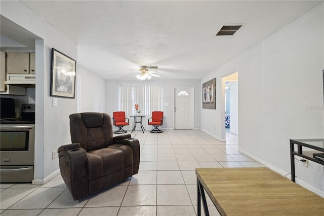 tiled living room featuring ceiling fan