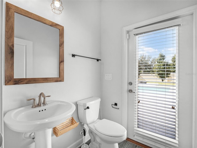 bathroom featuring sink and toilet