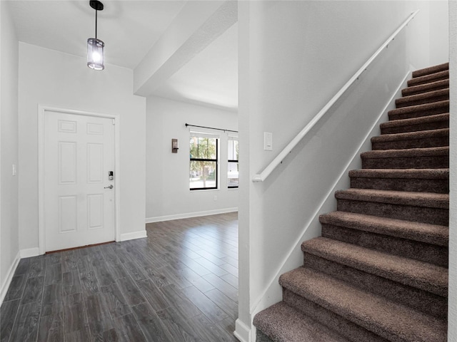 foyer with dark hardwood / wood-style floors